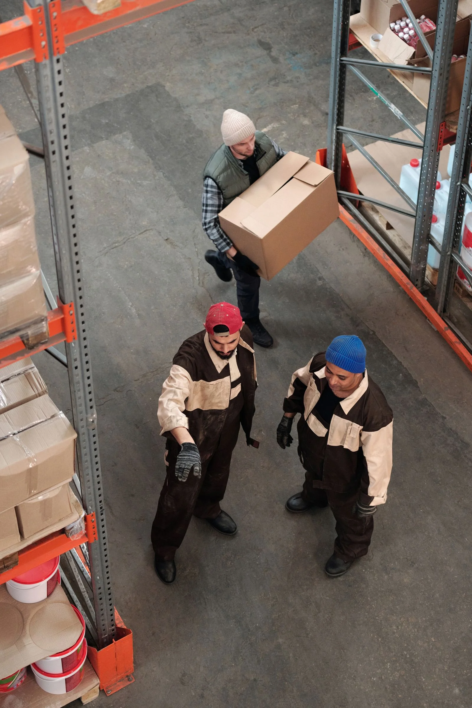 Warehouse workers managing inventory
